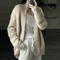 Cardigan beige in maglia intrecciata per donna