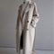 Manteau long en laine beige pour femme avec ceinture