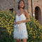 Vestito corto con paillettes e piume con spalline sottili per donna