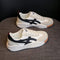 Chaussures de sport blanches et noires pour homme